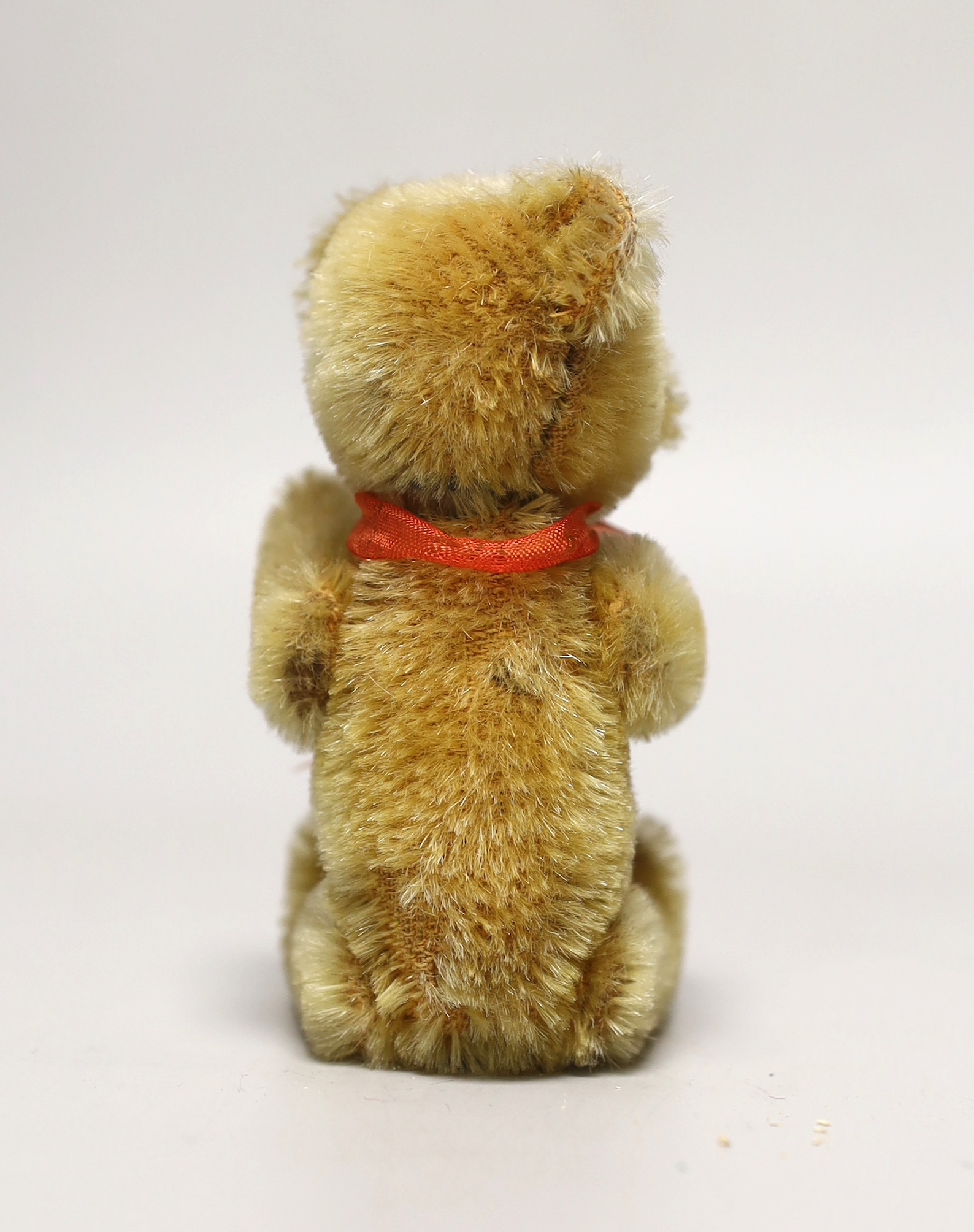 A Schuco perfume bear, 1950's, 5in., excellent condition, bottle complete